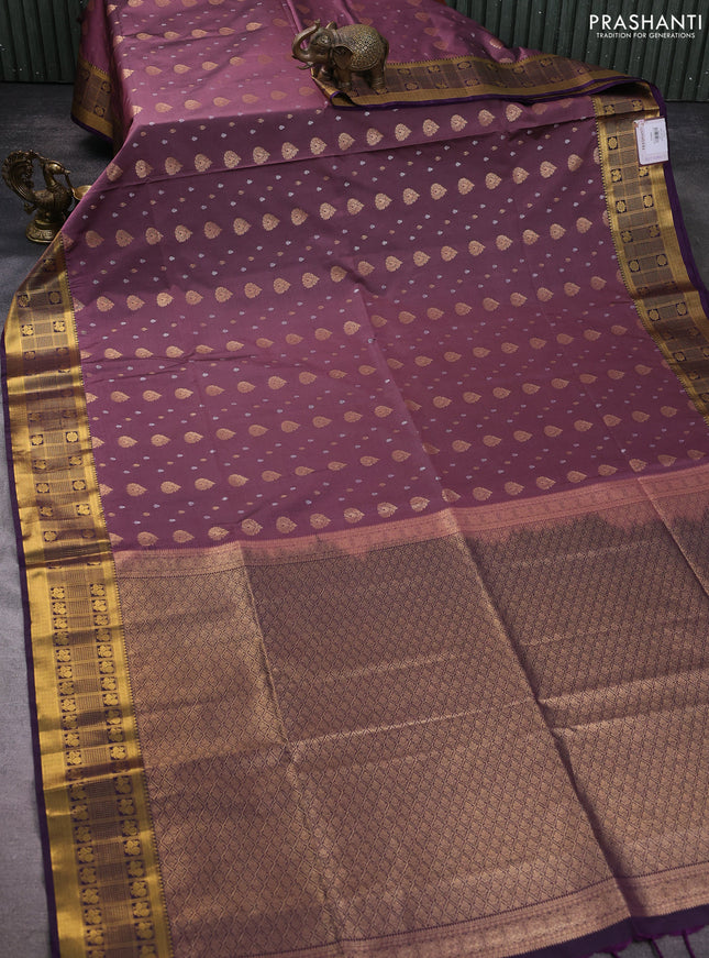 Semi soft silk saree rosy brown and purple with allover zari woven buttas and zari woven border