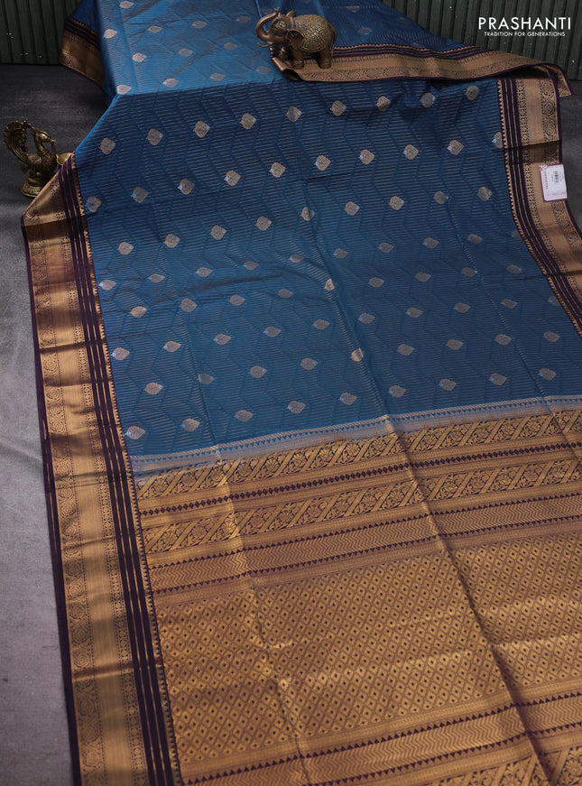 Semi soft silk saree teal green and violet with allover zari weaves & buttas and zari woven border