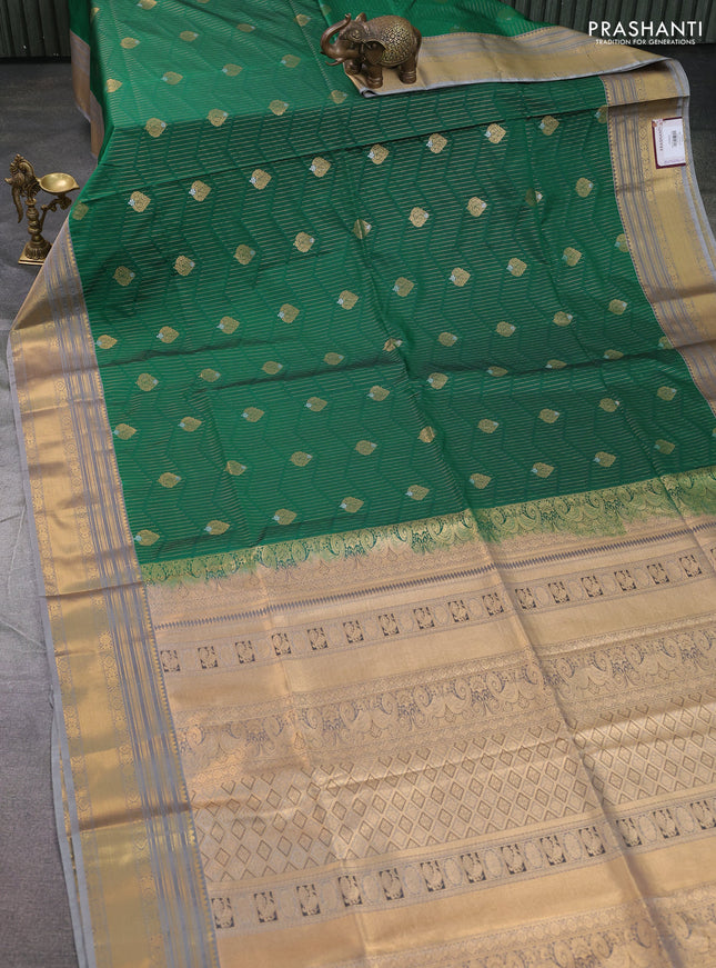 Semi soft silk saree green and grey with allover zari weaves & buttas and zari woven border
