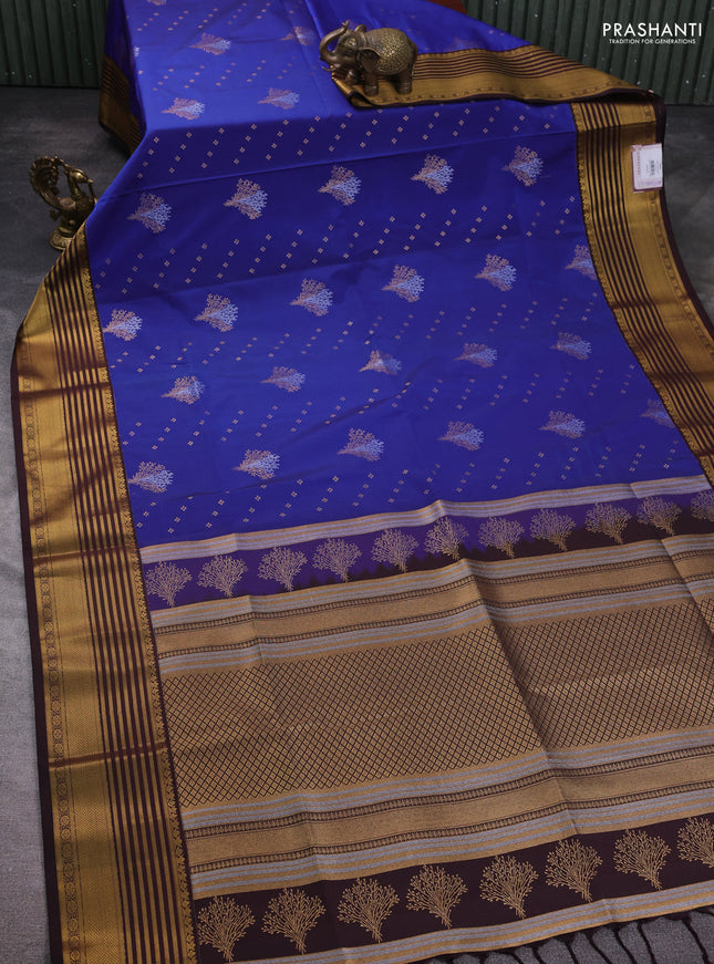 Semi soft silk saree blue and coffee brown with allover zari woven buttas and zari woven korvai border