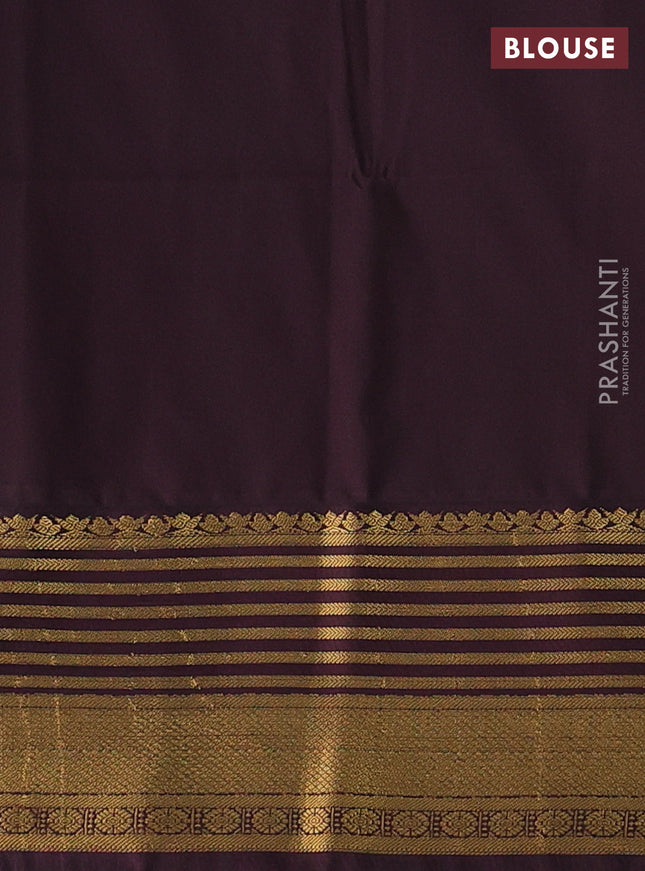 Semi soft silk saree blue and coffee brown with allover zari woven buttas and zari woven korvai border