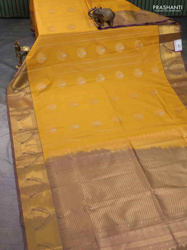 Semi soft silk saree mustard yellow and violet with allover zari weaves & buttas and zari woven butta korvai border