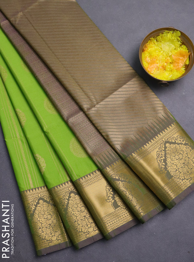 Semi soft silk saree parrot green and dual shade of greenish purple with allover zari weaves & buttas and zari woven butta korvai border