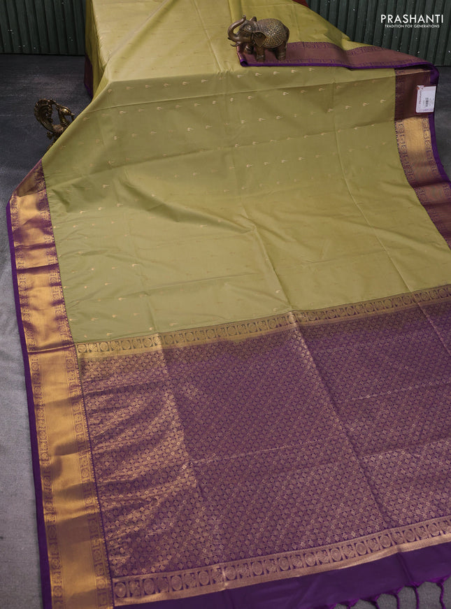 Semi soft silk saree elaichi green and purple with allover zari woven buttas and zari woven border