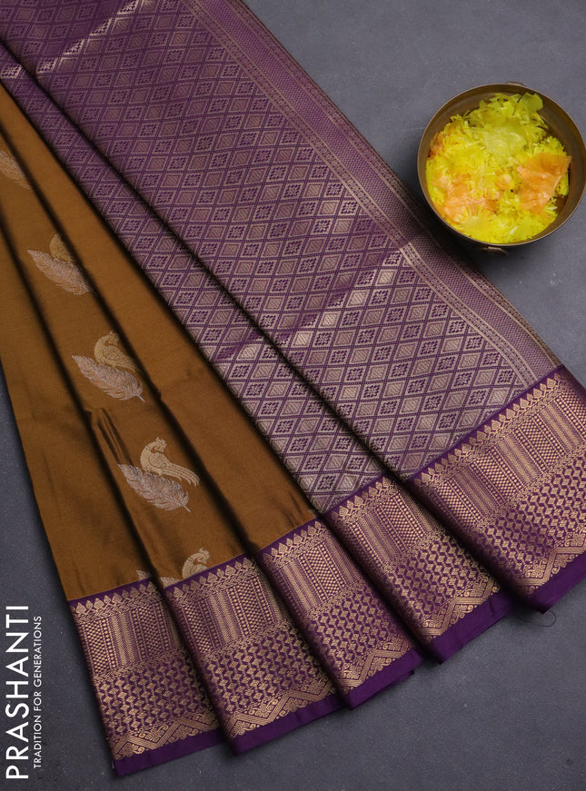 Semi soft silk saree dark mustard and purple witrh zari woven buttas and zari woven border