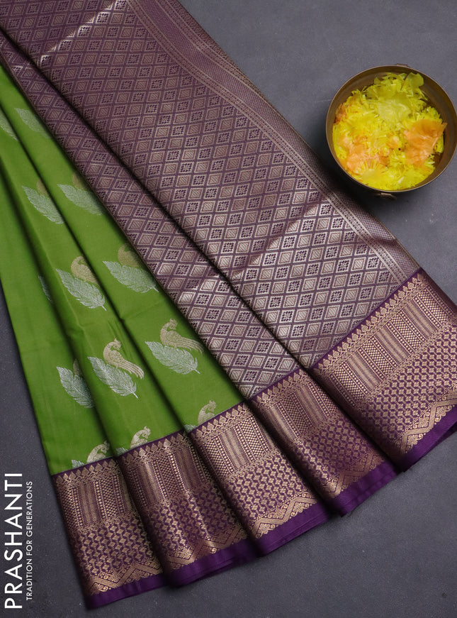 Semi soft silk saree light green and purple with zari woven buttas and zari woven border
