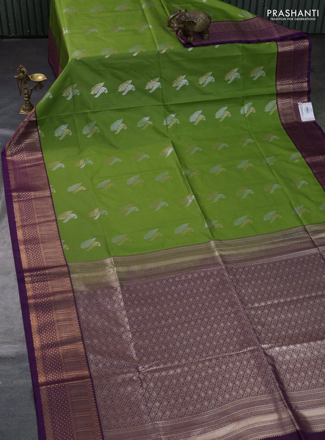 Semi soft silk saree light green and purple with zari woven buttas and zari woven border