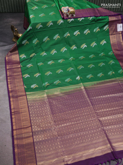 Semi soft silk saree green and purple with zari woven buttas and zari woven border