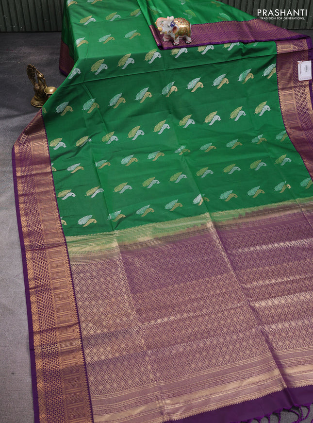 Semi soft silk saree green and purple with zari woven buttas and zari woven border