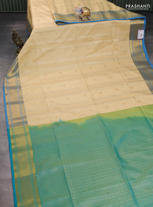Semi soft silk saree cream and cs blue with zari weaves & buttas and zari woven border