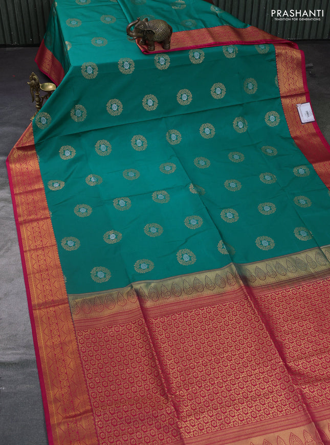 Semi soft silk saree teal green and pink with allover rudraksha zari woven buttas and zari woven korvai border
