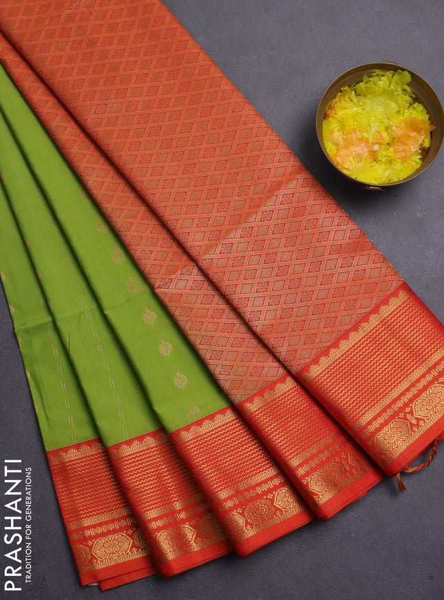 Semi soft silk saree light green and orange with allover zari woven buttas and zari woven border