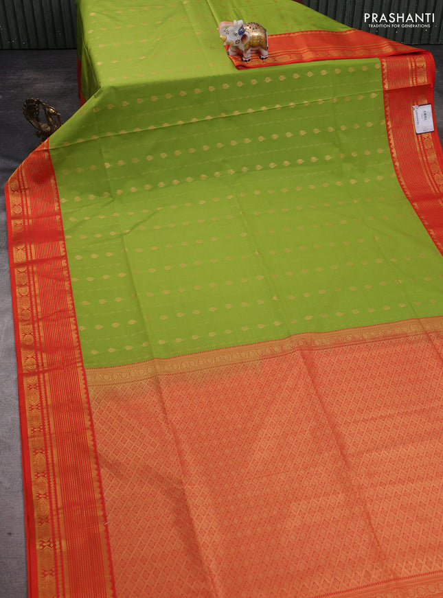 Semi soft silk saree light green and orange with allover zari woven buttas and zari woven border