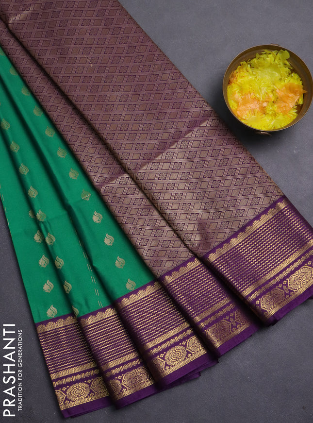 Semi soft silk saree green and purple with allover zari woven buttas and zari woven border