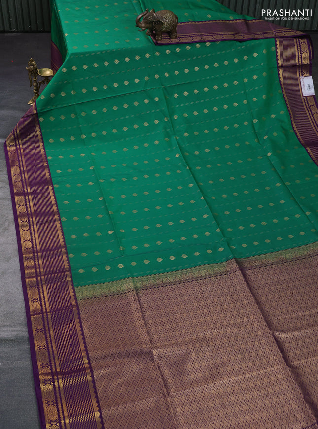 Semi soft silk saree green and purple with allover zari woven buttas and zari woven border