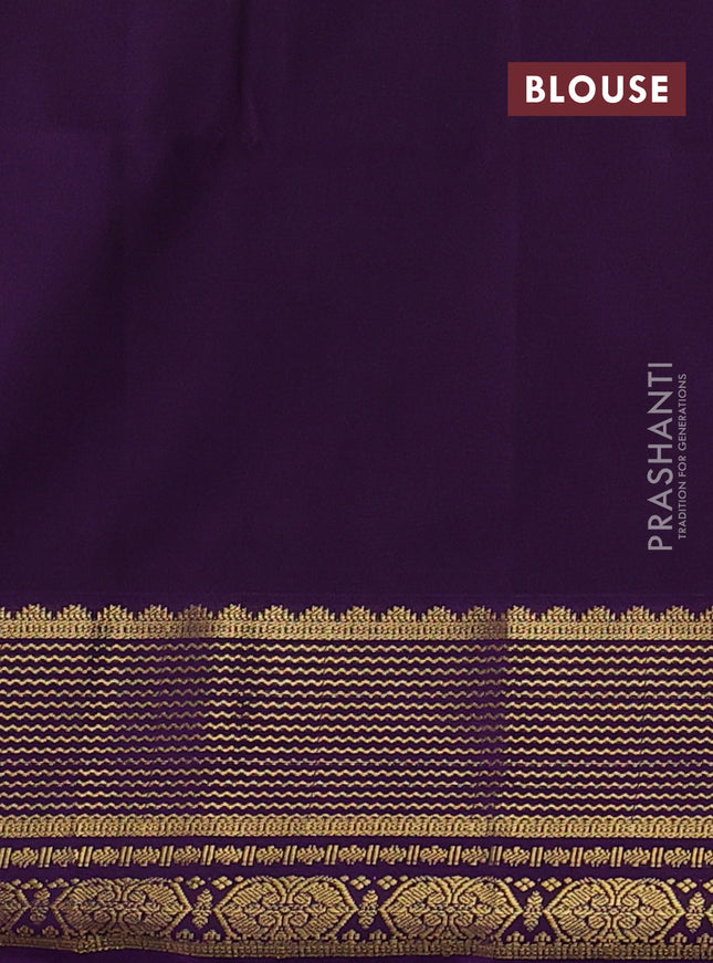 Semi soft silk saree green and purple with allover zari woven buttas and zari woven border
