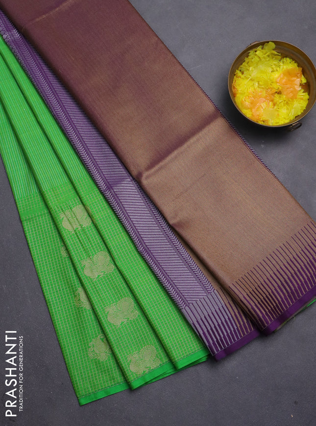 Semi soft silk saree green and purple with allover zari weaves & buttas and long zari woven butta border