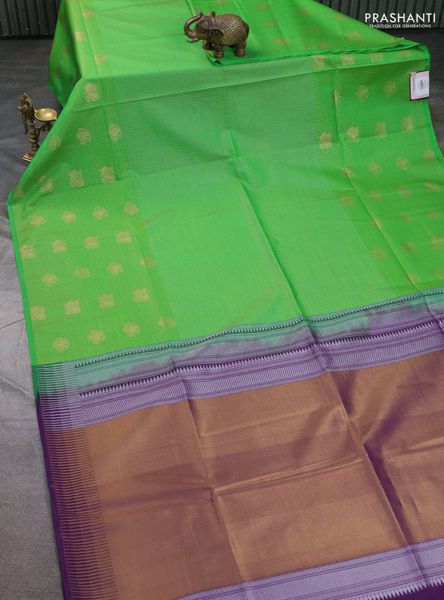 Semi soft silk saree green and purple with allover zari weaves & buttas and long zari woven butta border