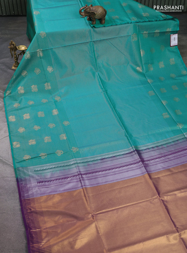 Semi soft silk saree teal blue and purple with allover zari weaves & buttas and long zari woven butta border