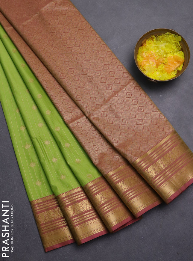Semi soft silk saree llime green and pink with allover zari weaves & buttas and zari woven korvai border