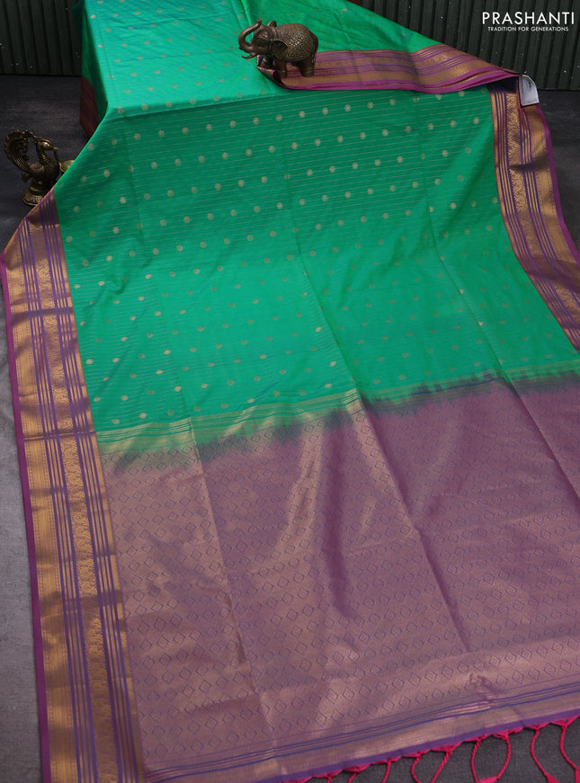 Semi soft silk saree teal green and peach pink with allover zari weaves & buttas and zari woven korvai border
