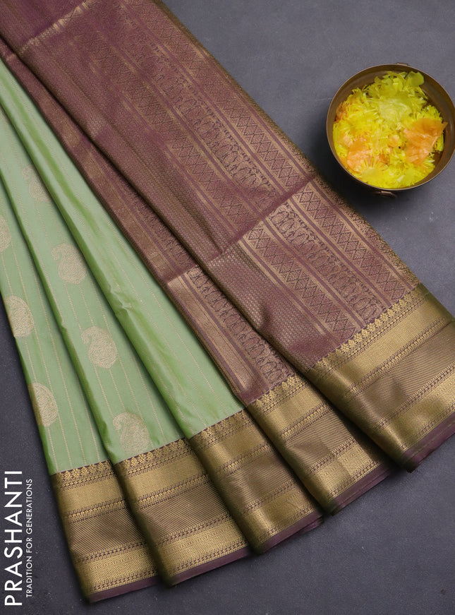 Semi soft silk saree pista green and dual shade of greenish purple with allover zari weaves & buttas and zari woven border