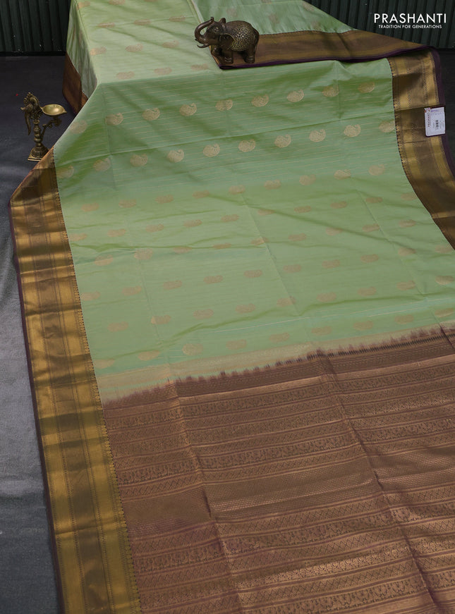 Semi soft silk saree pista green and dual shade of greenish purple with allover zari weaves & buttas and zari woven border