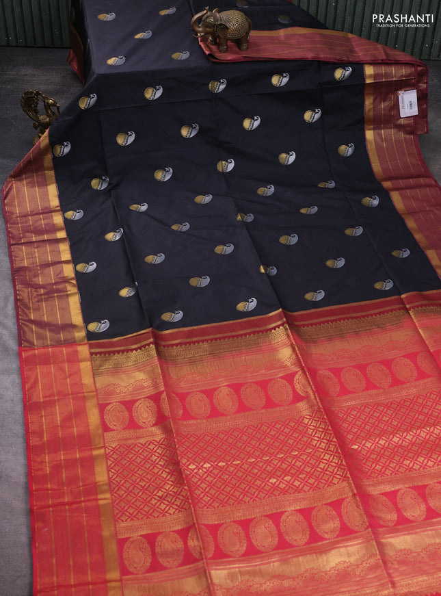 Semi soft silk saree black and peach pink with allover paisley zari woven buttas and zari woven border