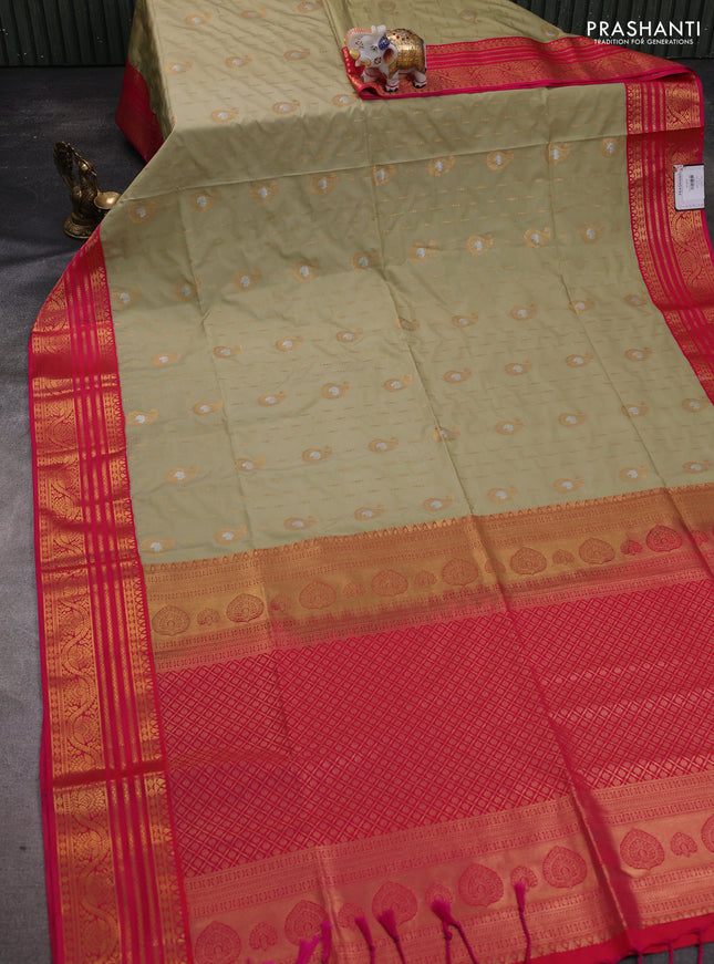 Semi soft silk saree pastel green and pink with allover zari woven buttas and zari woven border
