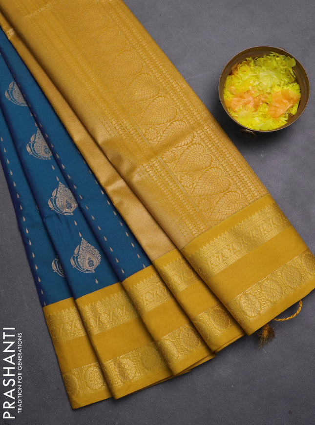 Semi soft silk saree blue and mustard yellow with allover zari woven buttas and zari woven korvai border
