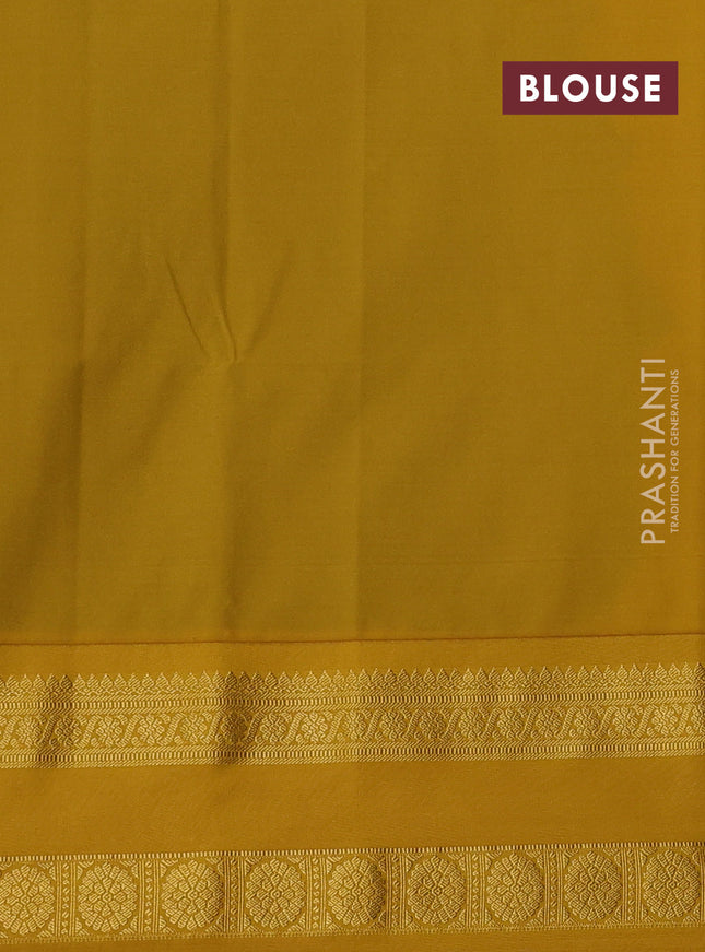 Semi soft silk saree blue and mustard yellow with allover zari woven buttas and zari woven korvai border