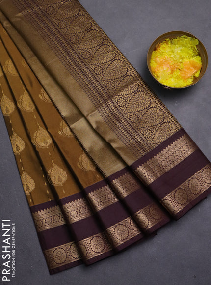 Semi soft silk saree dark mustard and coffee brown with allover zari woven buttas and zari woven korvai border