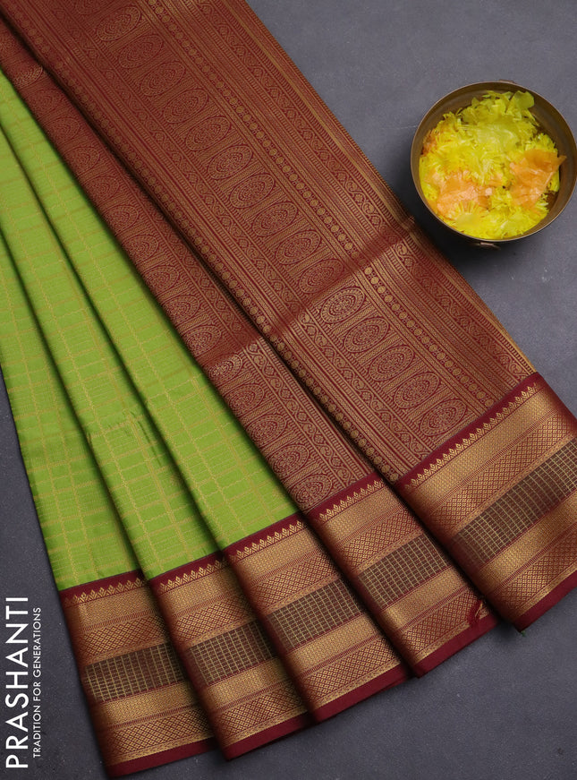 Semi soft silk saree light green and deep maroon with allover zari checks & buttas and zari woven border