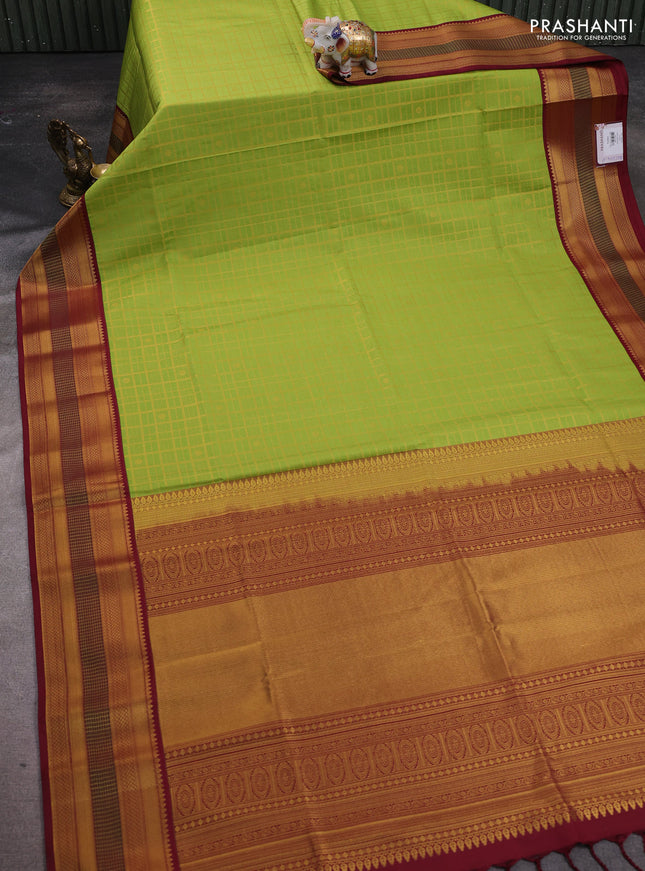Semi soft silk saree light green and deep maroon with allover zari checks & buttas and zari woven border