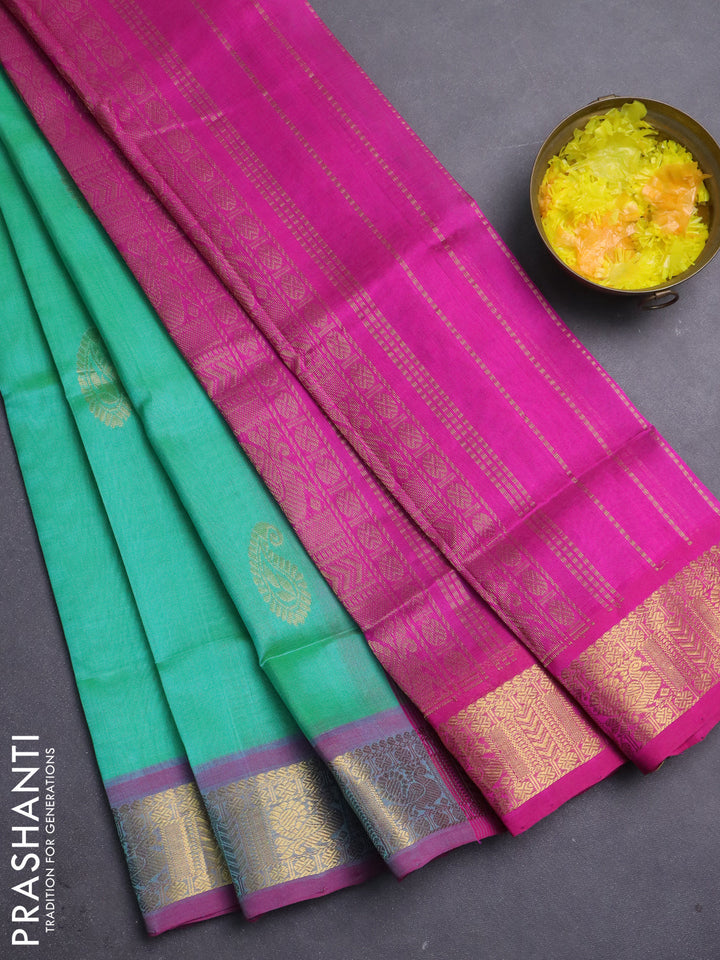 Silk cotton saree dual shade of green shade and pink with paisley zari woven buttas and zari woven border
