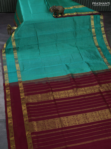 Silk cotton saree teal green and maroon with allover zari lakshadeepam patten and rettapet zari woven border