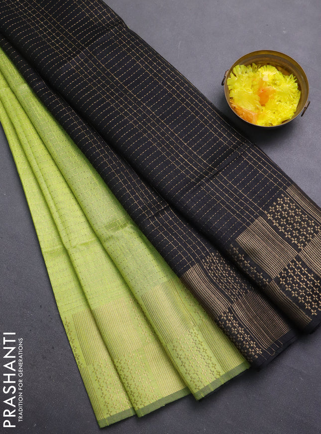 Semi dupion saree fluorescent green and black with allover zari stripes pattern and zari woven border