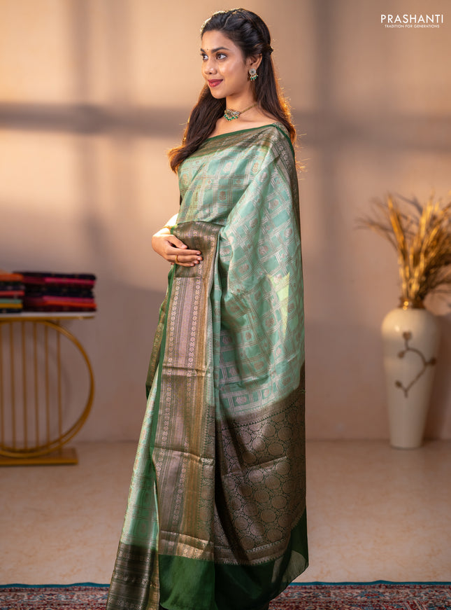 Banarasi warm silk saree pastel green and green with allover thread & zari checked pattern and long zari woven border