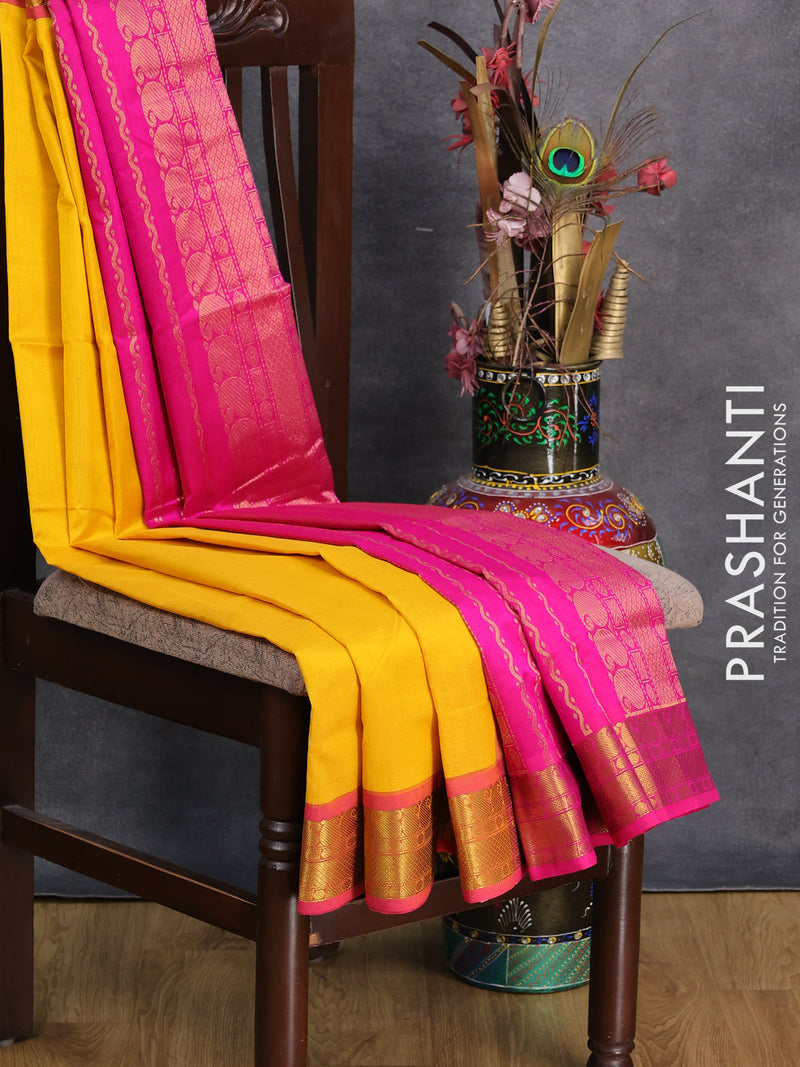Silk cotton saree mango yellow and pink with plain body and paisley zari woven border