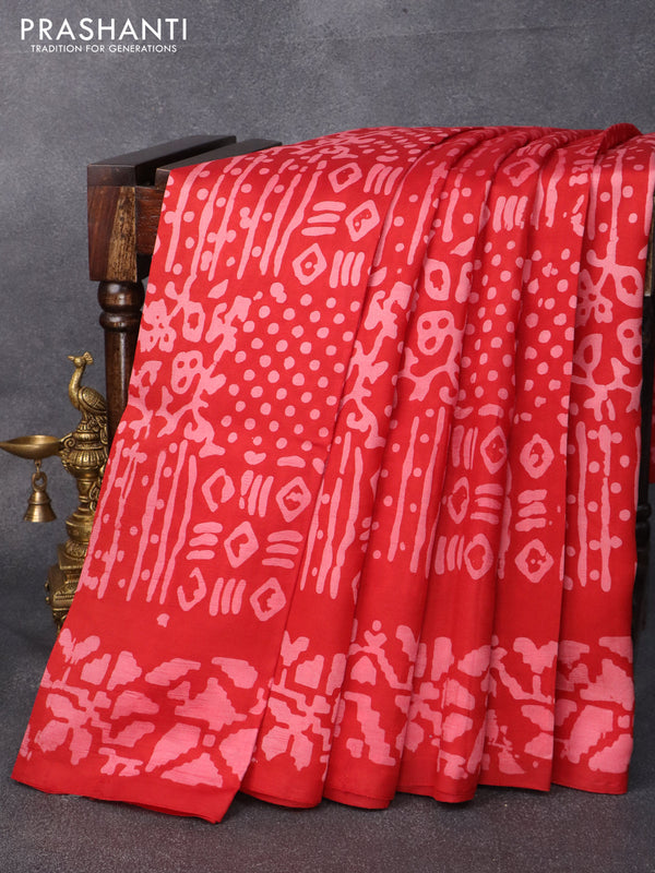 Printed silk saree red   with allover batik prints and printed border