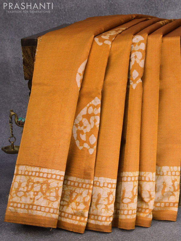 Printed silk saree mustard yellow   with batik butta prints and printed border