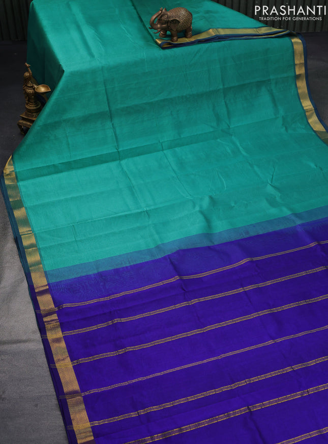 Silk cotton saree teal green and blue with plain body and small zari woven border