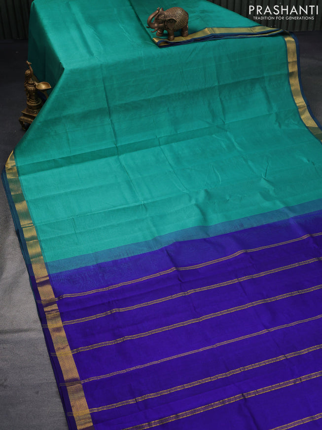 Silk cotton saree teal green and blue with plain body and small zari woven border