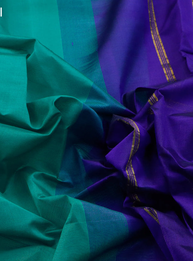 Silk cotton saree teal green and blue with plain body and small zari woven border