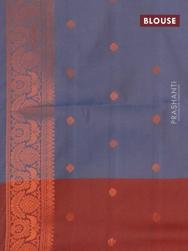 Semi soft silk saree dual shade of grey and maroon with copper zari woven box type buttas and simple border
