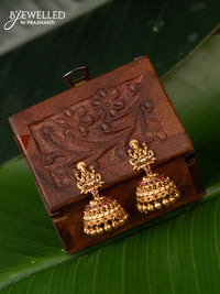 Antique jhumka lakshmi design with pink kemp stones and golden beads hanging