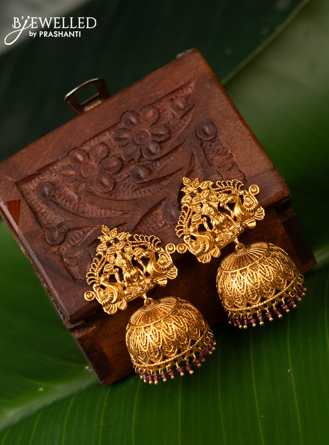 Antique jhumka lakshmi design with kemp stones and pink beads hanging