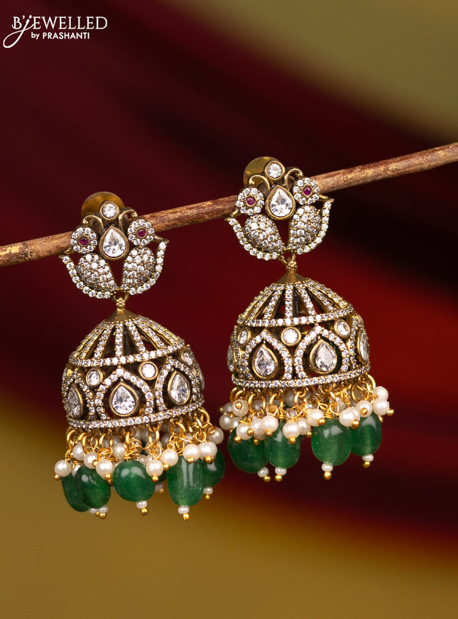 Victorian finish jhumka floral design with cz stone and green beads hangings