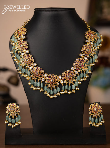 Antique necklace lotus design with kemp & kundan stones and pearl & beads hanging