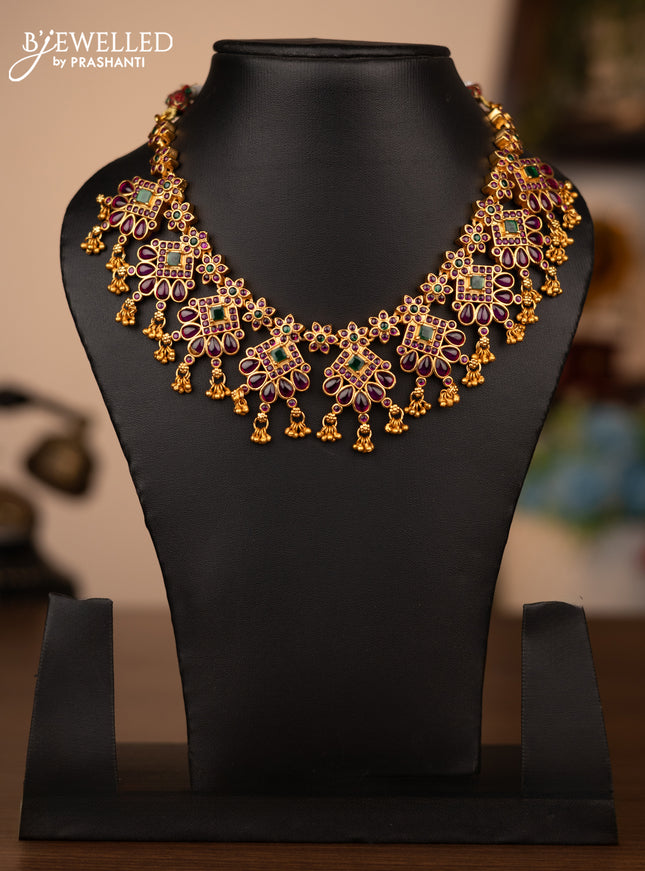 Antique necklace parrot design with kemp & cz stones and gold beads hanging without earrings